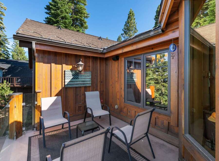 Enjoy the serene mountain views from this charming outdoor seating area, perfect for morning coffee or evening relaxation.