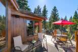 Enjoy outdoor living on this spacious deck, perfect for entertaining or relaxing amidst the trees.