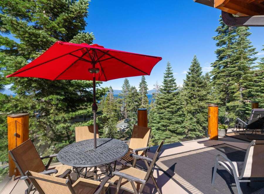 Enjoy breathtaking lake and mountain views from this stunning deck, perfect for outdoor entertaining.