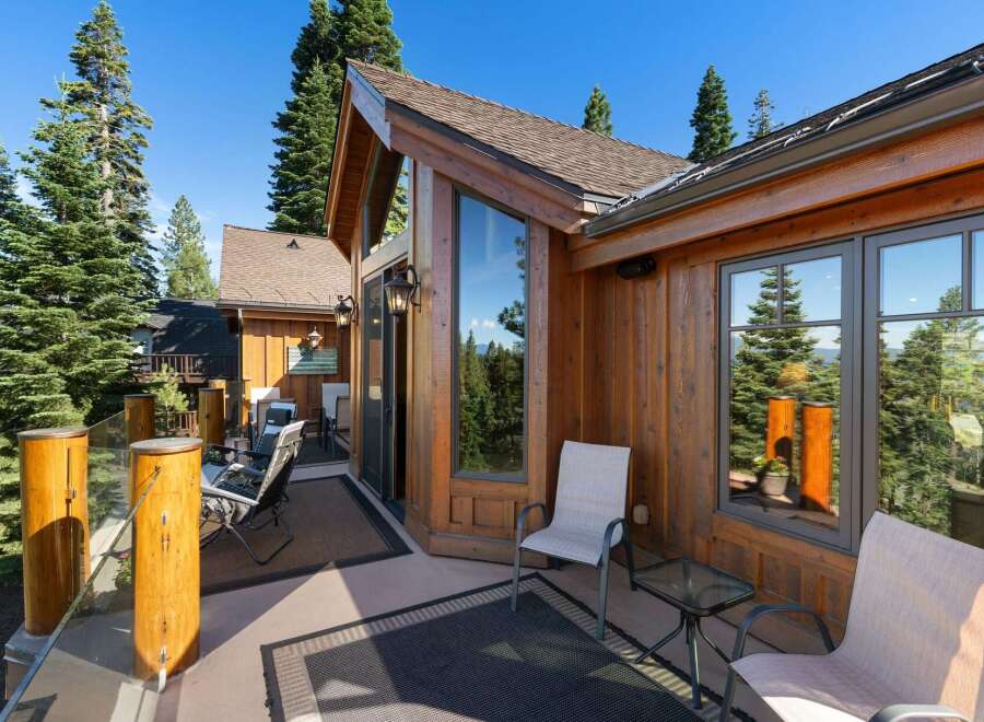 Enjoy breathtaking mountain and lake views from this stunning wooden deck, perfect for outdoor entertaining or quiet relaxation.