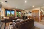 Experience breathtaking mountain views from this stunning living area, featuring a cozy seating arrangement perfect for relaxation.