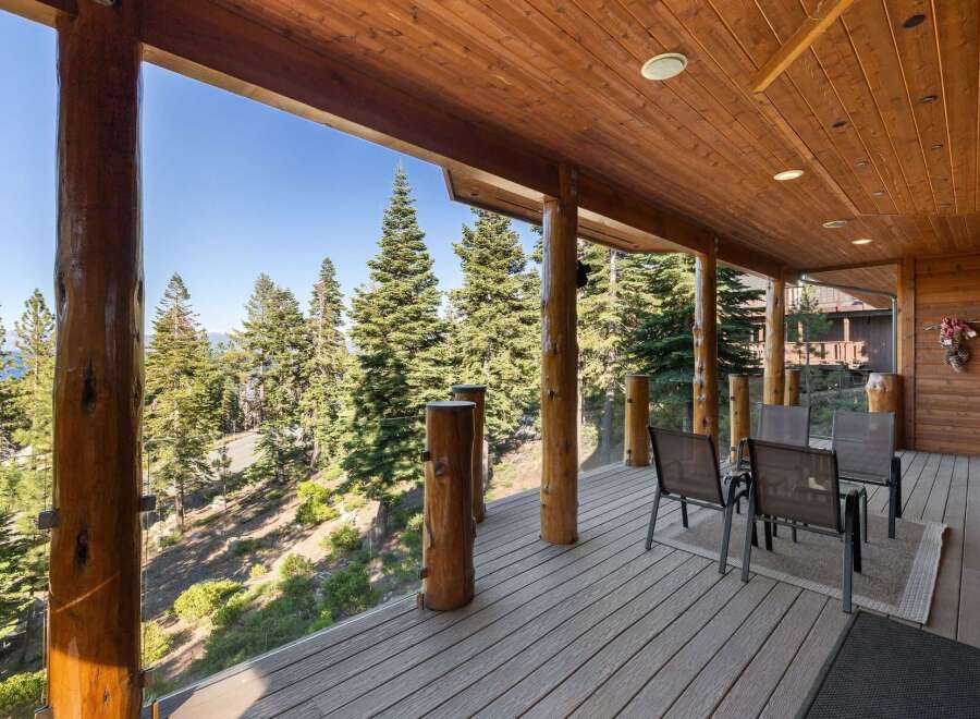 Experience breathtaking views from this stunning covered deck, perfect for enjoying the serene mountain landscape.