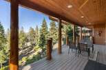 Experience breathtaking views from this stunning covered deck, perfect for enjoying the serene mountain landscape.