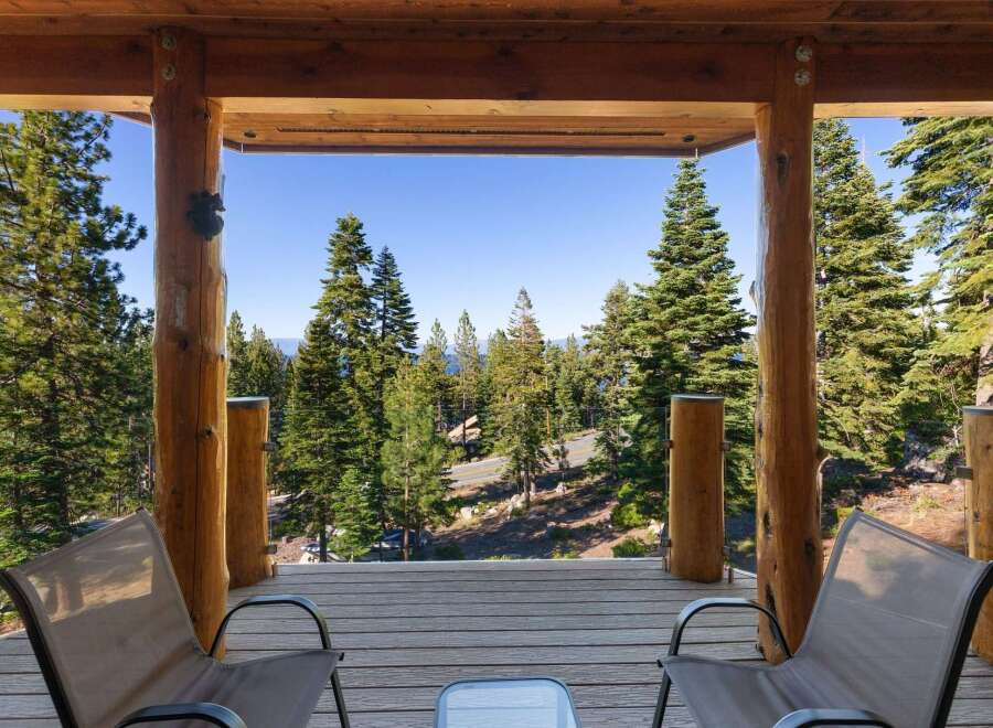 Experience breathtaking lake and mountain views from this stunning property's expansive deck, perfect for enjoying your morning coffee or evening sunsets.