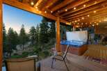 Experience ultimate relaxation on this stunning deck, complete with a luxurious hot tub offering breathtaking views of the surrounding pine forest and rolling hills.