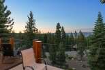 Enjoy breathtaking lake and mountain views from this stunning property's expansive deck, perfect for morning coffee or evening relaxation.