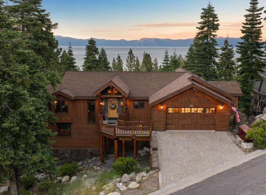 Experience breathtaking lake and mountain views from this stunning custom-built log home.