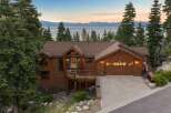 Experience breathtaking lake and mountain views from this stunning custom-built log home.