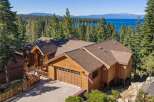 Experience luxury mountain living with this stunning timber-frame home offering breathtaking lake and mountain views.