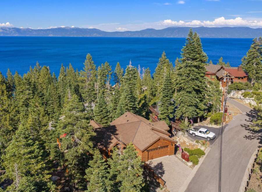 Experience breathtaking lake views from this stunning mountain retreat, nestled amidst towering pine trees.