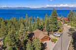 Experience breathtaking lake views from this stunning mountain retreat, nestled amidst towering pine trees.