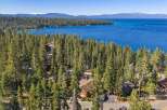 Experience the ultimate lakefront lifestyle with this stunning property nestled amidst towering pine trees.