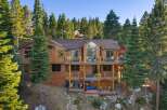 Experience luxury mountain living in this stunning multi-level wooden home nestled amidst towering pine trees.