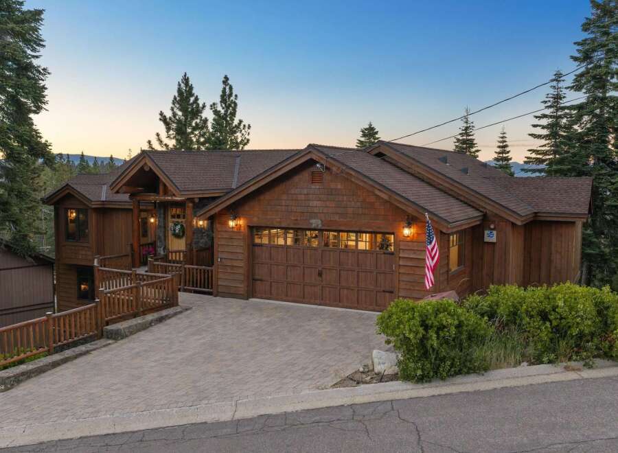 Experience mountain living in this stunning timber-framed home, nestled amongst towering pine trees.