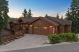 Experience mountain living in this stunning timber-framed home, nestled amongst towering pine trees.