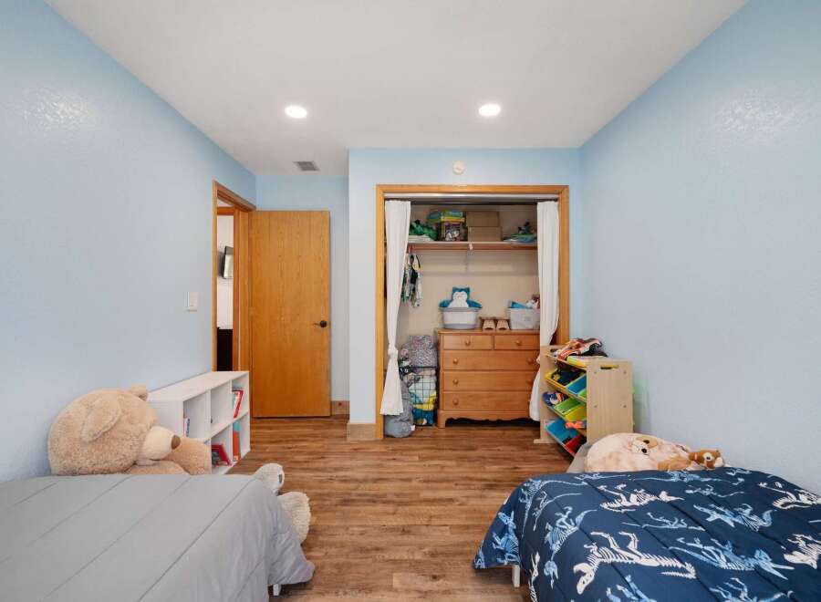 This charming bedroom features two cozy beds, perfect for siblings or sleepovers.