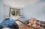 This charming bedroom features two twin beds, perfect for siblings or guests.