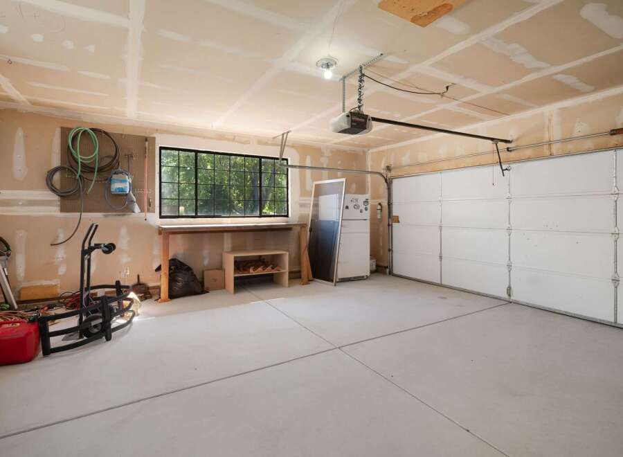 This spacious garage offers ample storage and workspace, perfect for any homeowner's needs.
