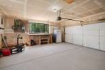 This spacious garage offers ample storage and workspace, perfect for any homeowner's needs.