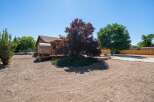 Discover unique living with this charming wooden barrel home, nestled on a spacious lot.