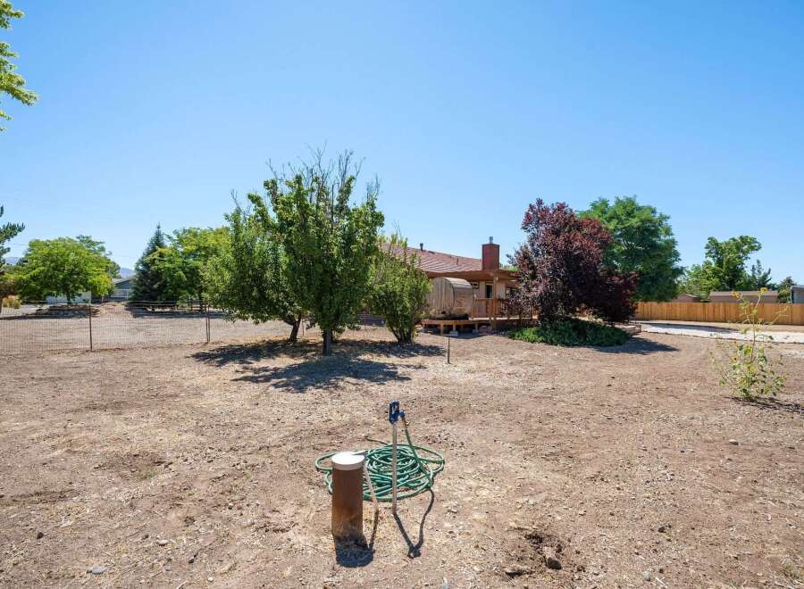Discover this expansive backyard, perfect for outdoor living and entertaining.
