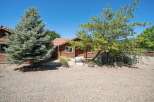 Charming wooden cabin nestled amongst mature trees, offering a serene and private retreat.