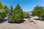 Discover this charming property featuring mature trees and a serene, natural landscape.