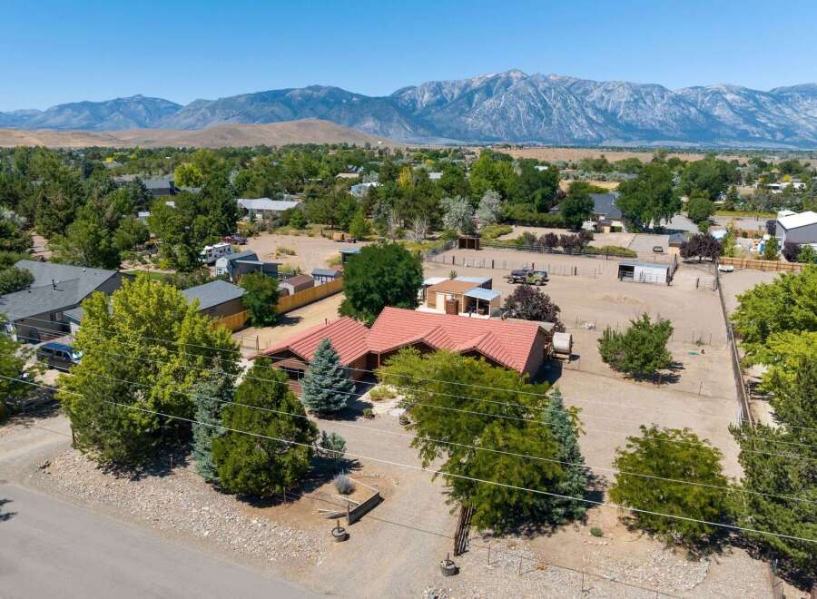 Discover this charming ranch-style home nestled against a stunning mountain backdrop.