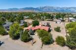 Discover this charming ranch-style home nestled against a stunning mountain backdrop.