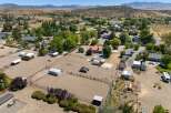 Discover this expansive property featuring a large riding arena, perfect for equestrian enthusiasts.