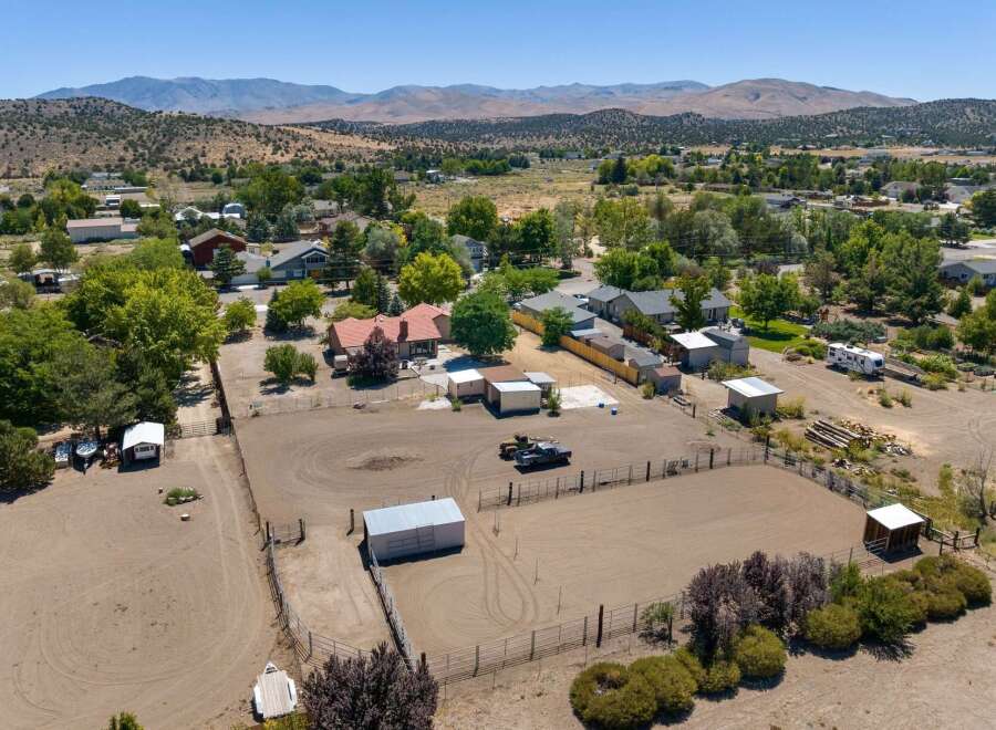 Discover this expansive property featuring a large riding arena perfect for equestrian activities.