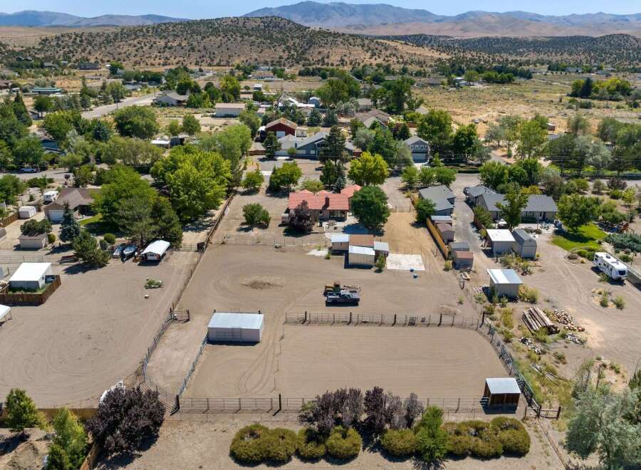 Discover this expansive property featuring a large riding arena, perfect for equestrian enthusiasts.