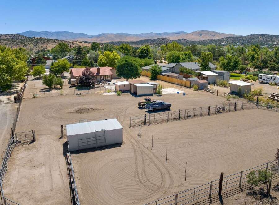 Discover this expansive property featuring a large, fenced arena perfect for equestrian activities.