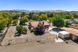 Discover this charming home nestled amidst mature trees and scenic mountain views.