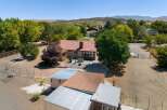Discover this charming home featuring a spacious backyard with a patio, perfect for outdoor entertaining.