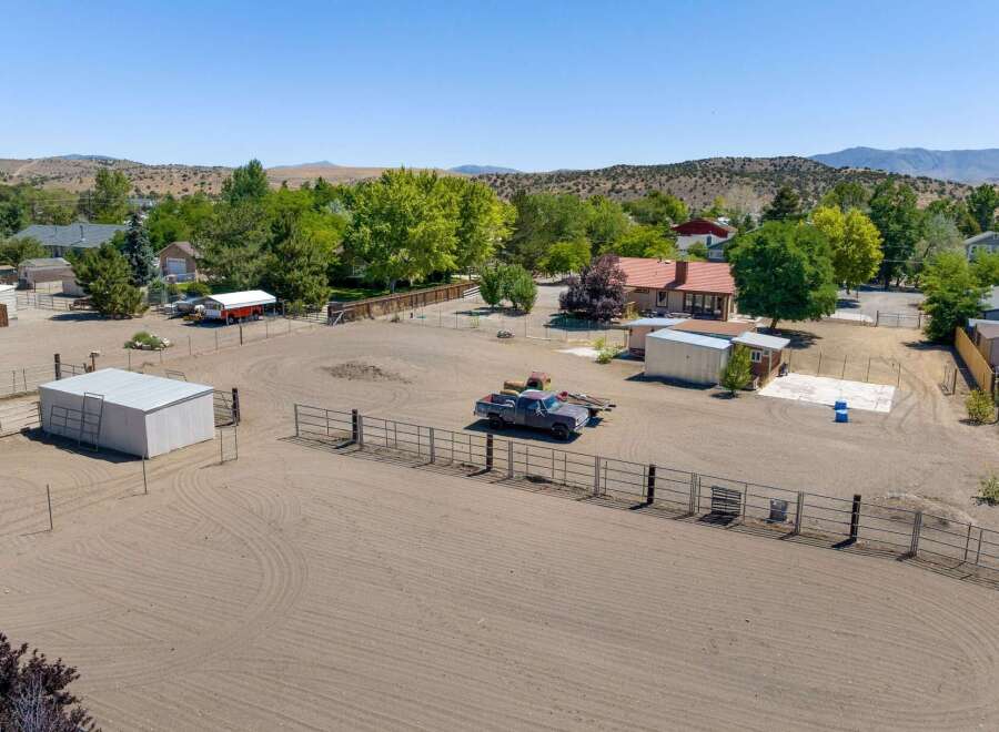 Discover this expansive property featuring a spacious arena perfect for equestrian activities or outdoor events.