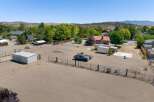 Discover this expansive property featuring a spacious arena perfect for equestrian activities or outdoor events.
