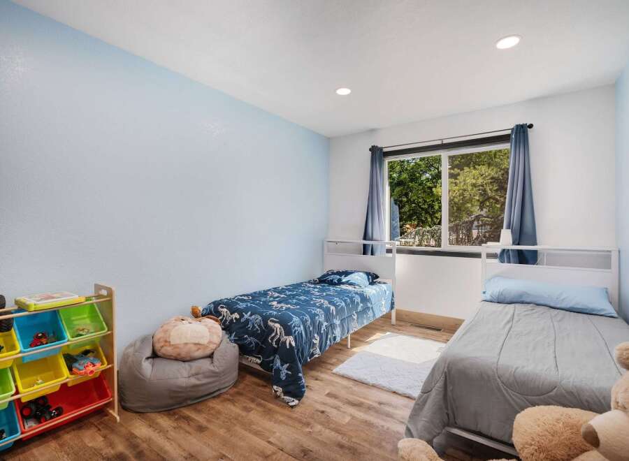 This charming bedroom features two twin beds, perfect for siblings or guests.