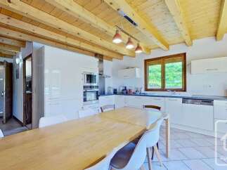 Discover this charming kitchen and dining area, perfect for family gatherings.