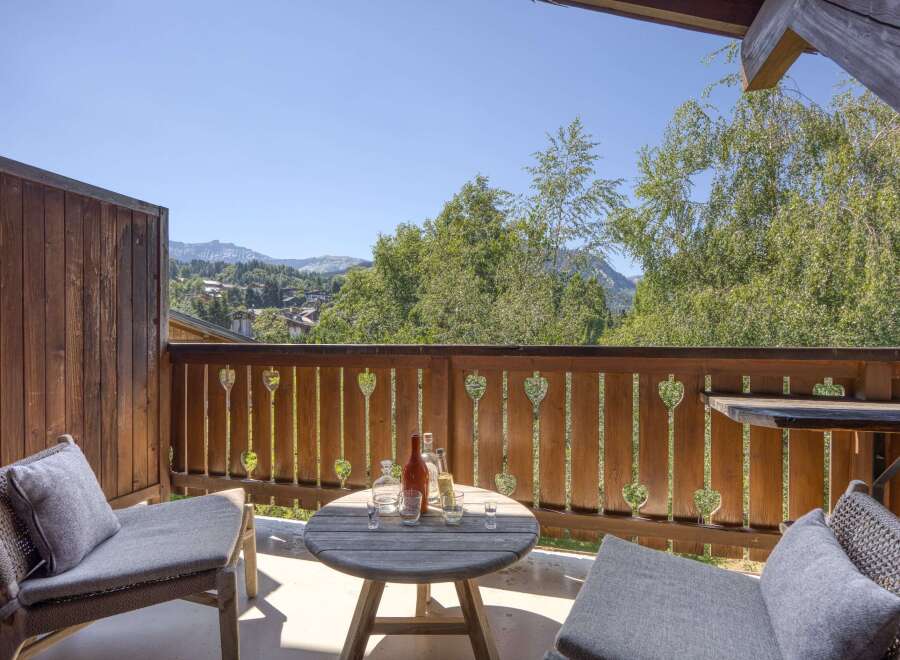 Enjoy breathtaking mountain views from this charming balcony, perfect for morning coffee or evening drinks.