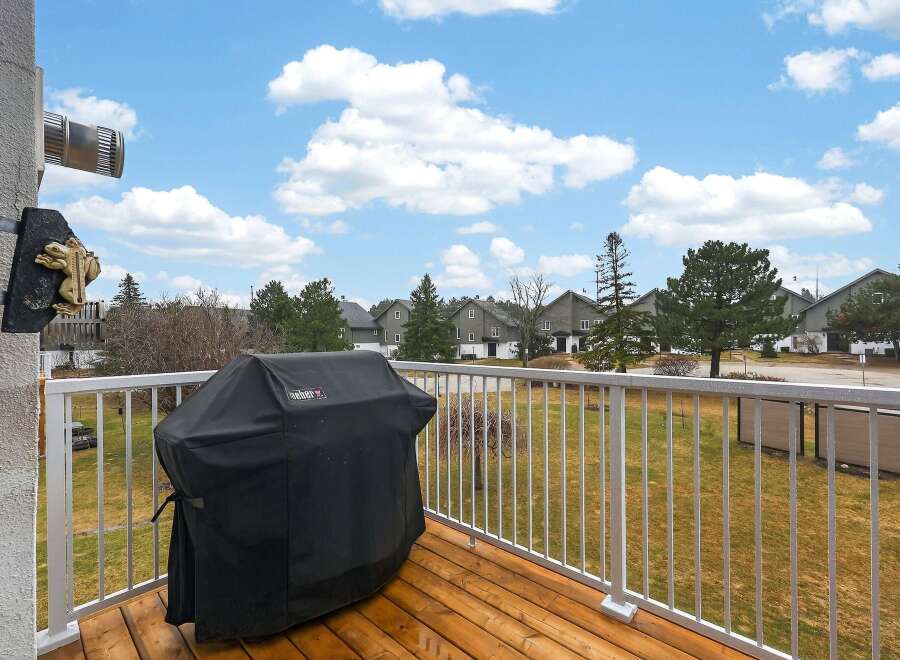 Enjoy outdoor living on this spacious balcony, perfect for entertaining or relaxing.