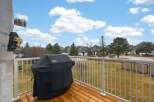 Enjoy outdoor living on this spacious balcony, perfect for entertaining or relaxing.