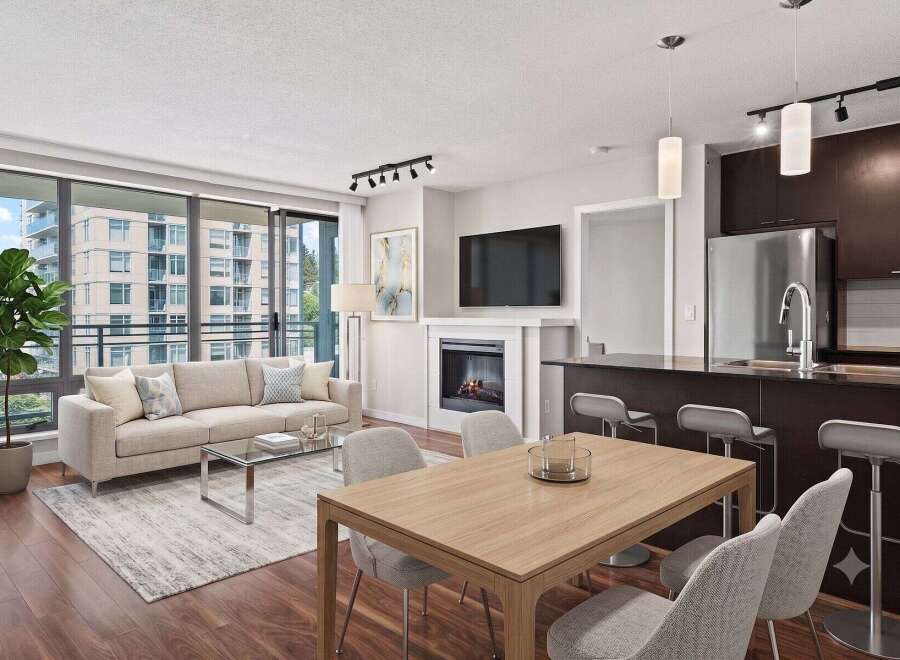 Experience modern living in this stunning condo featuring a spacious open-concept living area with a cozy fireplace and large windows.