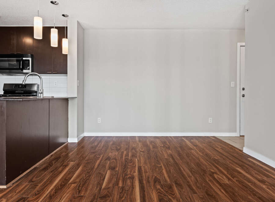 Discover this spacious and modern living area, featuring rich hardwood floors that extend throughout the home.