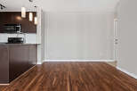 Discover this spacious and modern living area, featuring rich hardwood floors that extend throughout the home.