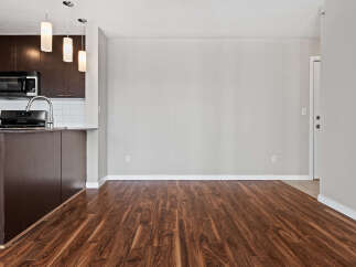 Discover this spacious and modern living area, featuring rich hardwood floors that extend throughout the home.