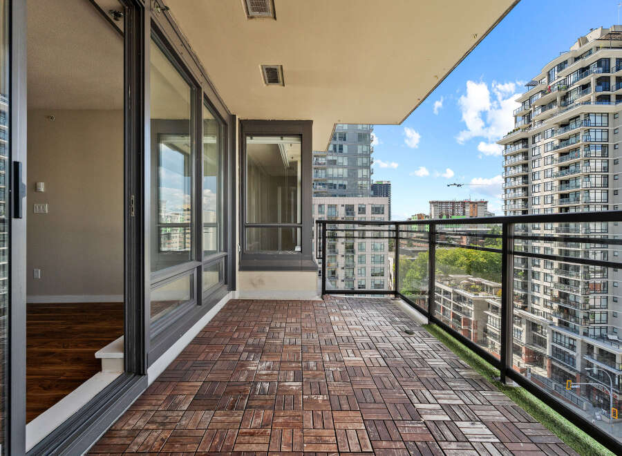 Enjoy breathtaking city views from this spacious balcony, perfect for entertaining or relaxing.