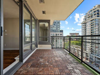 Enjoy breathtaking city views from this spacious balcony, perfect for entertaining or relaxing.