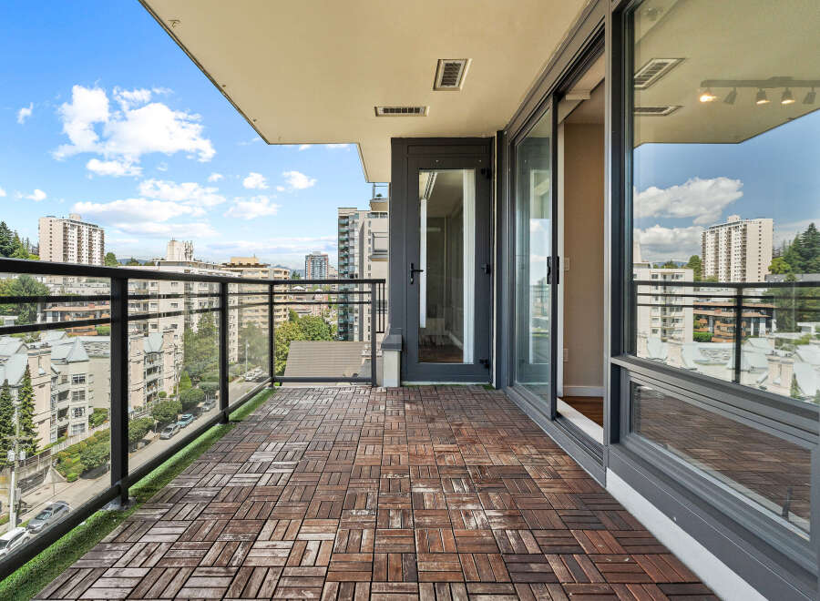 Enjoy breathtaking city views from this spacious balcony, perfect for outdoor living and entertaining.
