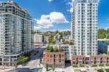 Experience modern urban living in this stunning apartment complex featuring sleek architecture and expansive balconies.